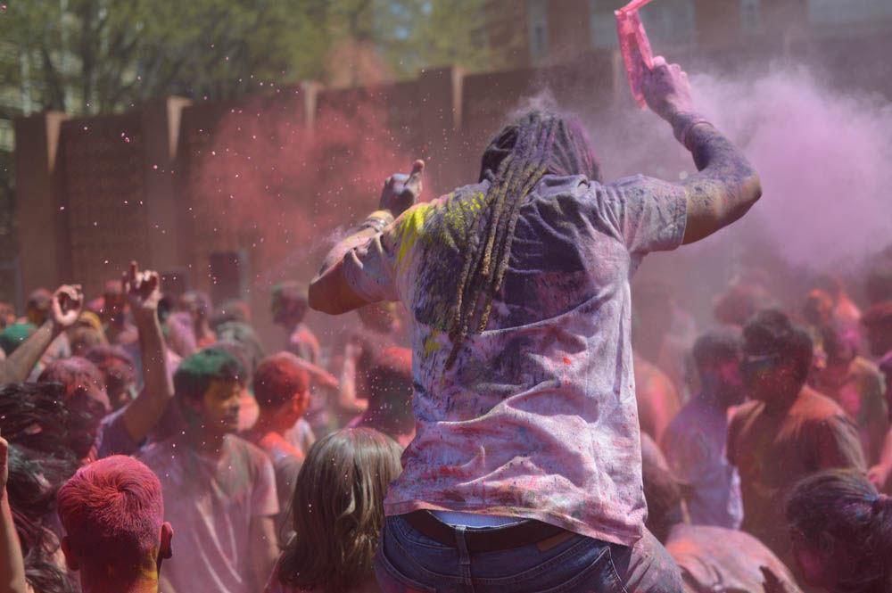 Participants dance and throw colors during the Holi Festival on Lee Fields, Sunday, April 2, 2017. Holi is a Hindu spring festival of colors typically celebrated in India and Nepal. Holi is hosted by Ektaa, Maitri at NCSU, Delta Sigma Iota, and Multicultural Student Affairs.