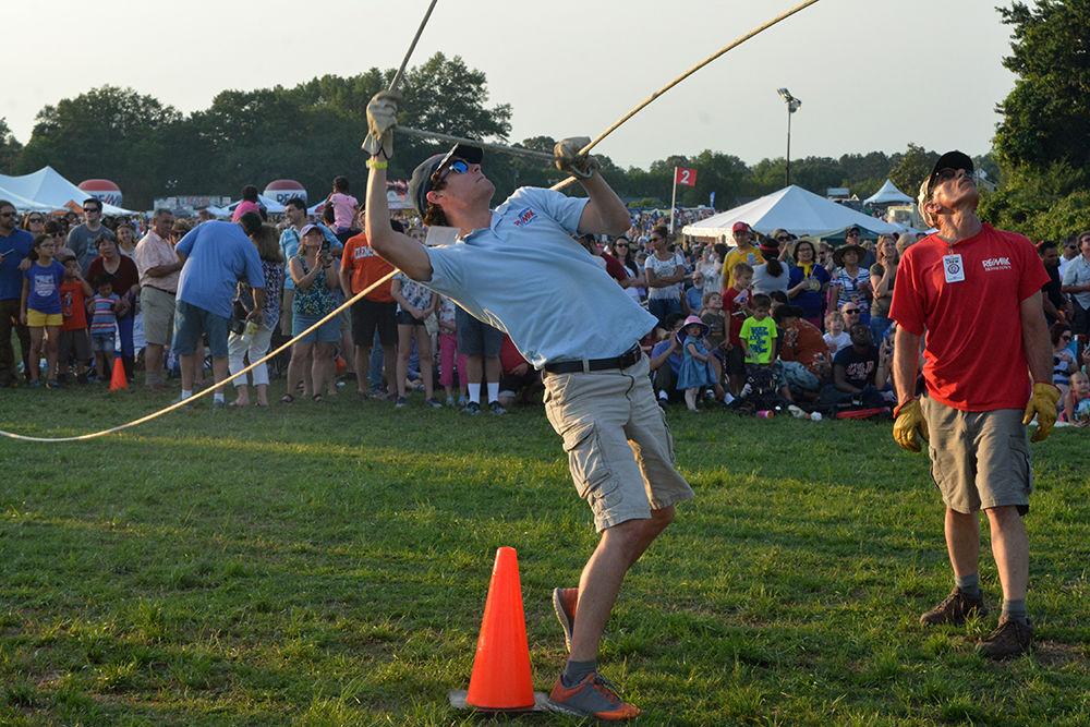 Bob Manzak supervises the set up of a hot air balloon at the WRAL Freedom Balloon Festival on May 27, 2017 in Fuquay-Varina. When he is not setting up hot air balloons, Manzak works on Centennial Campus at All Systems Broadband. The event featured more than 30 hot air balloons, food and beer vendors and live music performances.