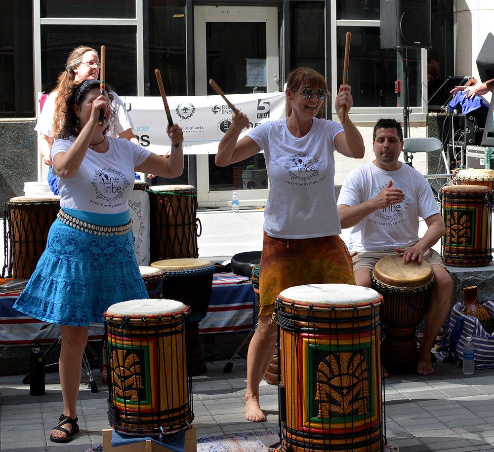 Kids and adults celebrate at Artsplosure on May 20, 2017. Many people rose to dance, while others watched. The live music took place in the kids section of the festival, "Kidsplosure."