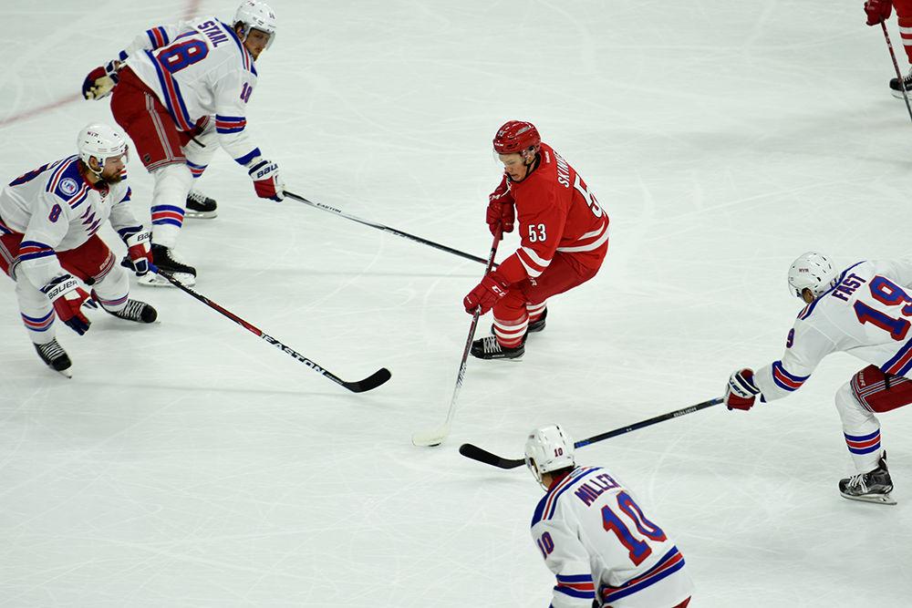 Hurricanes forward Jeff Skinner weaves through multiple Rangers players to score during the first period. Skinner earned two goals and an assist during the Canes' home opener against the New York Rangers held in PNC Arena on Oct. 28, 2016. The Hurricanes defeated the Rangers 3-2. Skinner led the Hurricanes with a career-high 37 goals last season. The team is currently looking for added scoring to support him next year.