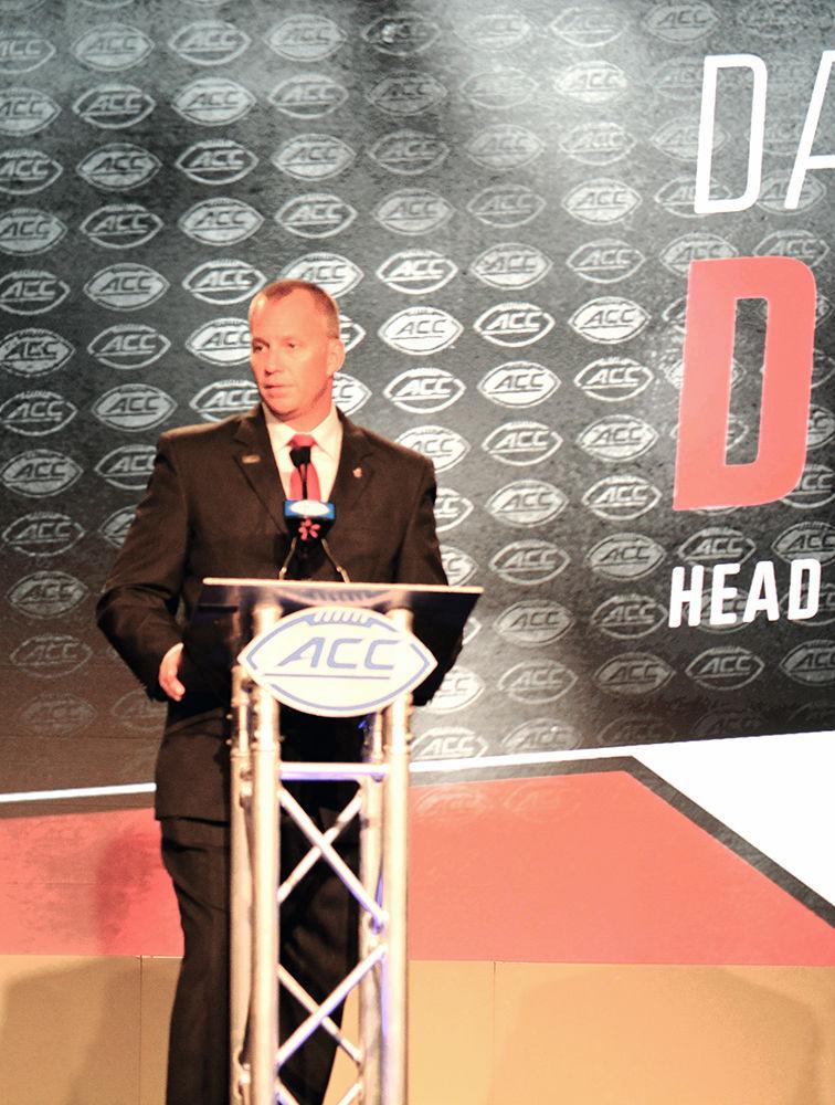 Head coach Dave Doeren speaks to a crowd of reporters at the 2017 ACC Kickoff on Thursday, July 13 in Charlotte, North Carolina. Doeren said the summer workouts will translate to a stronger team this season.