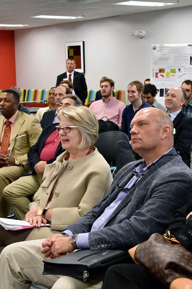 UNC System President Margaret Spellings listens as students and alumni present their wearable technology in the Nonwovens Institute on Wednesday. Spellings&#8217; tour started at the ASSIST Lab and ended with a bus tour of Centennial Campus before stopping for lunch in Talley Student Union.