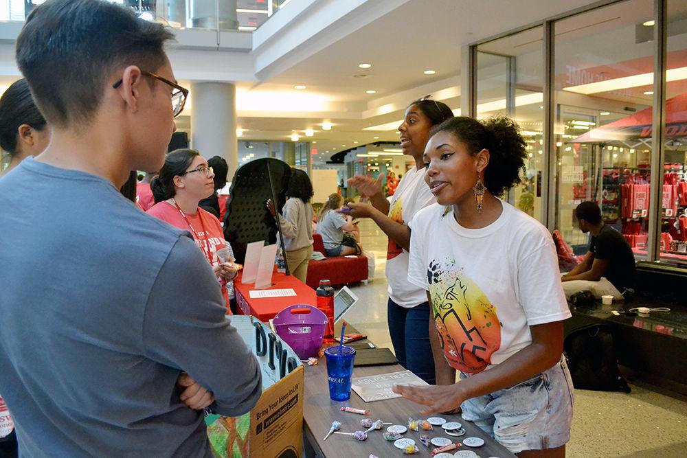 Alexis Roston, a third-year studying fashion and textile management, talks to Sam Crochet, a second-year studying computer science, during Respect the Pack on Tuesday, August 15 in Talley Student Union. Roston and Crochet talked about diversity and inclusion as venture experience (DIVE). DIVE is an annual trip that strives to create a safe place to bring students of different identities together on an outdoor excursion.