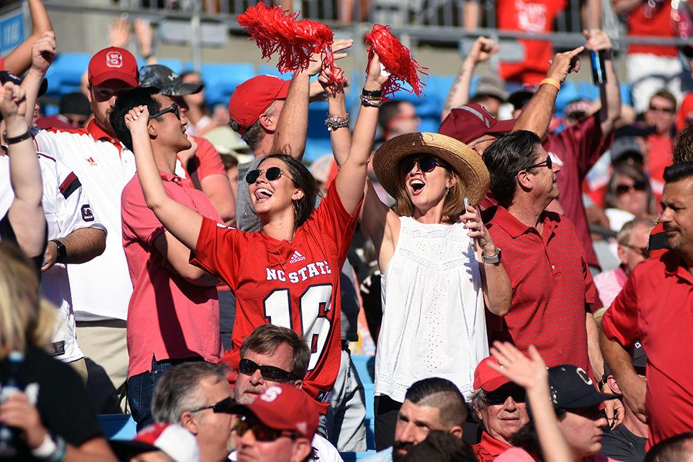 Wolfpack fans dance between plays at the University of South Carolina vs. NC State football game in the Bank of America Stadium on Saturday, Sept. 2. South Carolina won the game with a final score of 35-28.