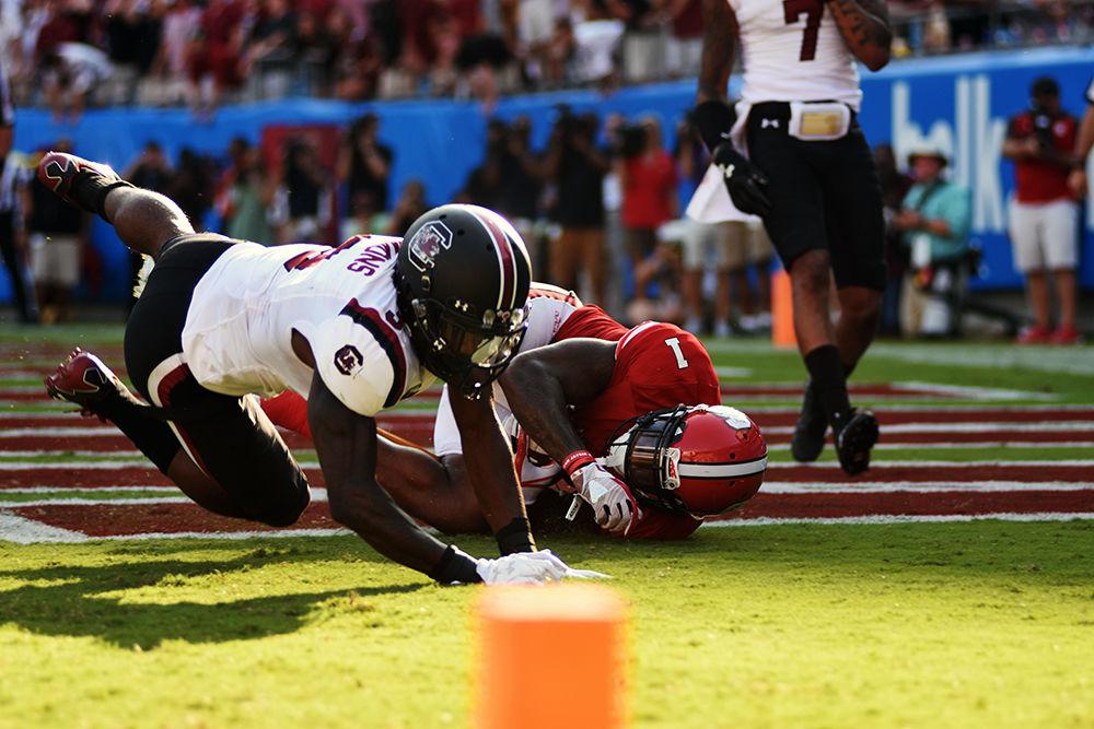 Halfback senior Jaylen Samuels goes down after a University of South Carolina player hits him. Samuels had 15 catches for 85 yards for one touchdown. The Gamecocks won 35-28.