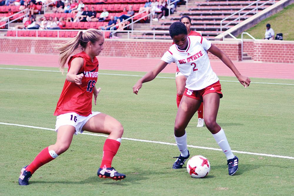 Sophomore midfielder Tziarra King boxes out a Davidson player and looks for a pass inside. The NC State women's soccer team beat Davidson 4-0 at Dail Soccer Stadium on Sunday, Sept. 10.