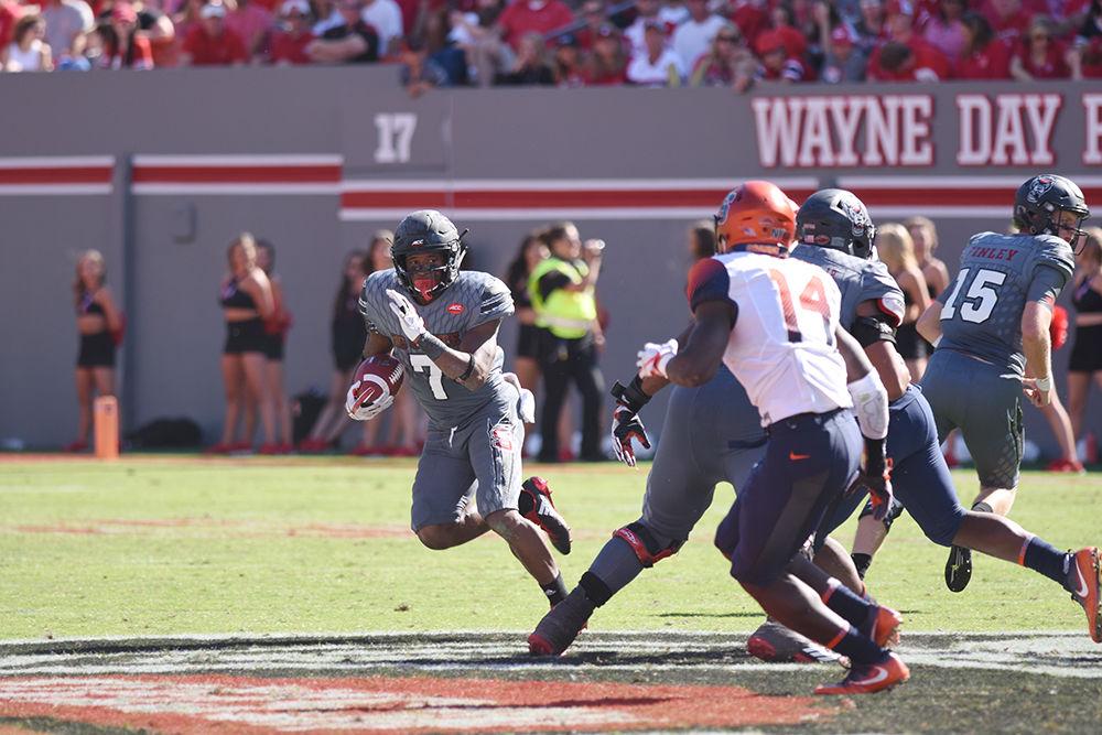 Junior running-back Nyheim Hines runs the ball down the field at the N.C. State V. Syracuse football game on Saturday, Sept. 30, 2017. N.C. State prevailed over Syracuse in a33-25 win for the Wolfpack.