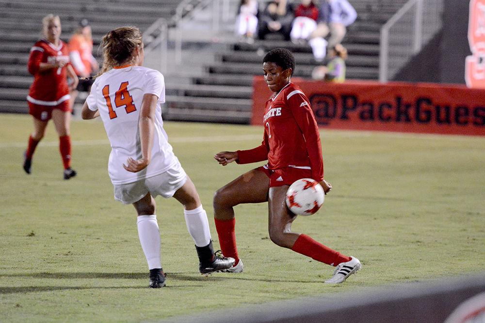 Sophomore midfielder Tziarra King defends a Clemson forward during the game in Dail Soccer Stadium. The Wolfpack would go on to win the game 1-0 on Thursday.