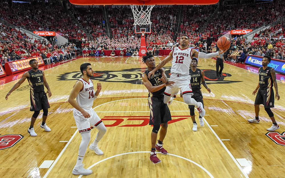 Graduate transfer guard Allerik Freeman drives past the Florida State defense to go up for a layup. Freeman had a team-high 25 points, four rebounds, four steals, and three assists during the 92-72 dominant performance over Florida State on Sunday, Feb. 25 in PNC Arena.