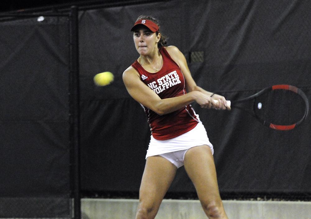 Sophomore Adriana Reami returns a ball to her opponent at the NC State vs. ECU women's tennis match at the J.W. Isenhour Tennis Center on Thursday. The Wolfpack won against the pirates with a final score of 5-2.