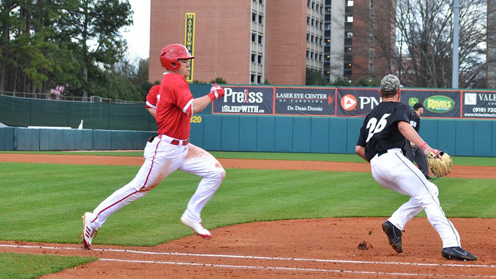 Brett Kinneman, a junior outfielder, runs to first base during the baseball game against UNC-Charlotte in Doak Field at Dail Park on Feb. 21. The Wolfpack beat the 49ers 9-6, ending Charlotte's undefeated streak.