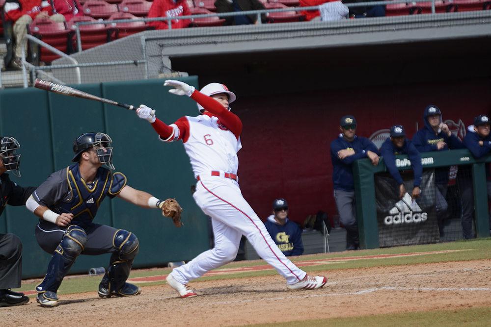 Junior outfielder Brett Kinneman hits a home run against Georgia Tech on Sunday at Doak Field. Kinneman went 2-5 with one home run and two RBIs as the Wolfpack won 9-6.