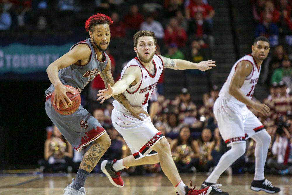 Freshman guard Braxton Beverly attempts to steal the ball away from Boston College's Ky Bowman. The Pack played one of the worst first halves of basketball this season toward a 14 point deficit before nearly making the greatest second-half comeback in ACC Tournament history before breaking down in the final minute. The Pack fell 91-87 to Boston College on Wednesday, March 7 inside of Barclays Center in Brooklyn, NY.