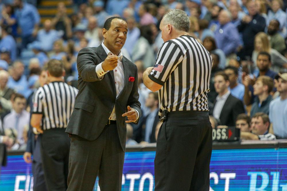 Head coach Kevin Keatts discusses a call with the ref before going into the locker room for half-time during the 95-91 overtime thriller over UNC in the Smith Center on Saturday, Jan. 27.