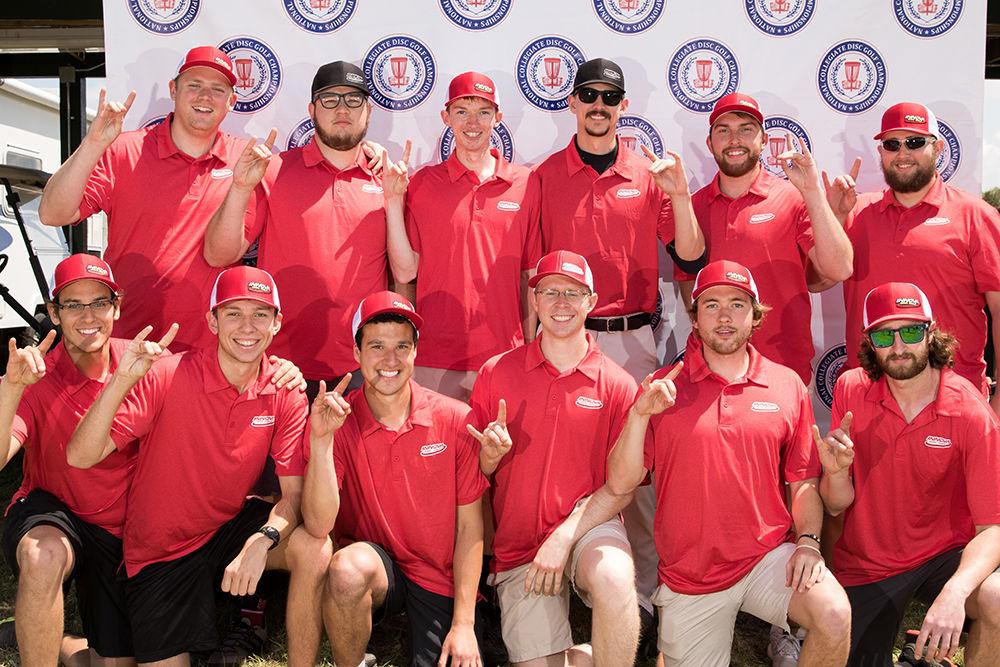 The NC State disc golf club members throw up their Wolfies after nationals in Augusta, South Carolina. The Wolfpack brought home two championships at the event.