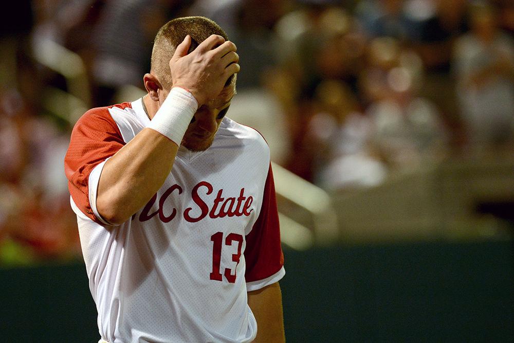 Senior outfielder Brock Deatherage hangs his head after striking out at Doak Field on Friday. The Wolfpack lost to Army 5-1.