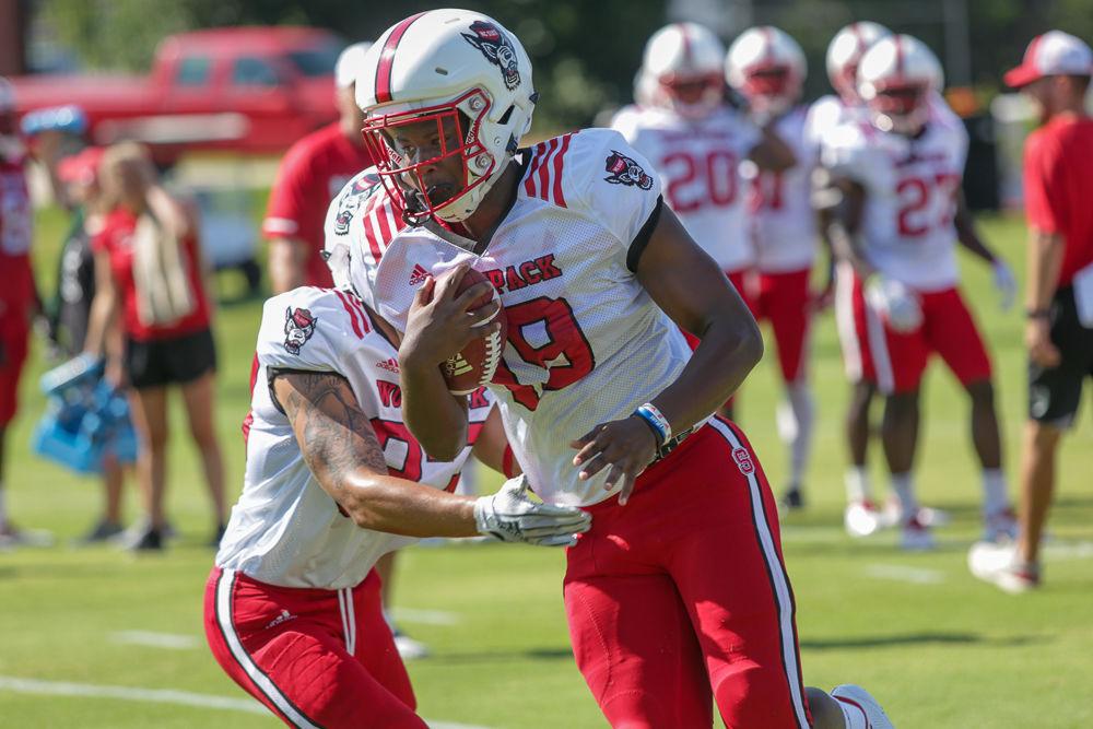Freshman safety Malik Dunlap makes a run past a defender in a drill at practice Thursday morning.