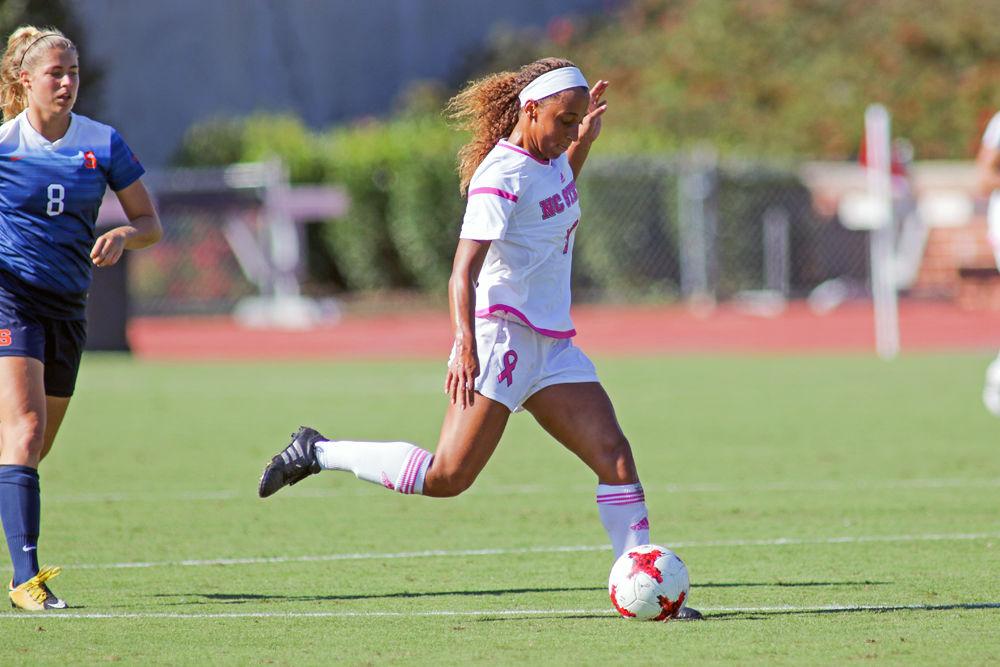 Junior forward Maxine Blackwood splits the defense to bring the ball upfield during the 3-0 win over Syracuse on Saturday, Oct. 14, 2017 at Dail Soccer Stadium.