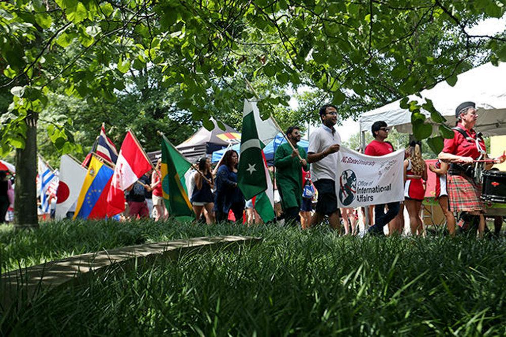 Students participate in the Parade of Flags at Packapalooza on Aug. 22, 2015.&#160;
&#160;