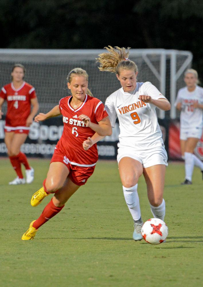 Sophomore defender Lulu Guttenberger fights for possession of the ball. The NC State women&#8217;s soccer team tied Virginia 0-0 in overtime at Dail Soccer Stadium on Sept. 15, 2017.