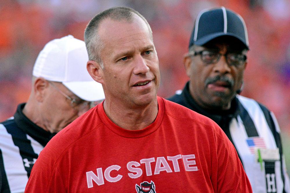 Head Coach Dave Doeren walks back to the sideline after talking to referees during the 41-7 loss to Clemson on Saturday, Oct. 20 at Clemson Memorial Stadium. Doeren is 0-6 against Clemson while coaching the Wolfpack.
