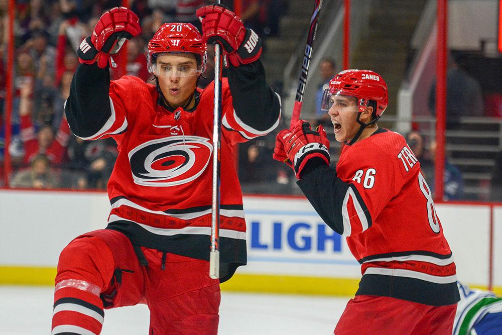 Carolina Hurricanes right wing Sebastian Aho and left Teuvo Teravainen celebrate Aho's goal against the Vancouver Canucks on Tuesday, Oct. 9 in PNC Arena. The Hurricanes beat Vancouver 5-3 for their third straight regular season win.