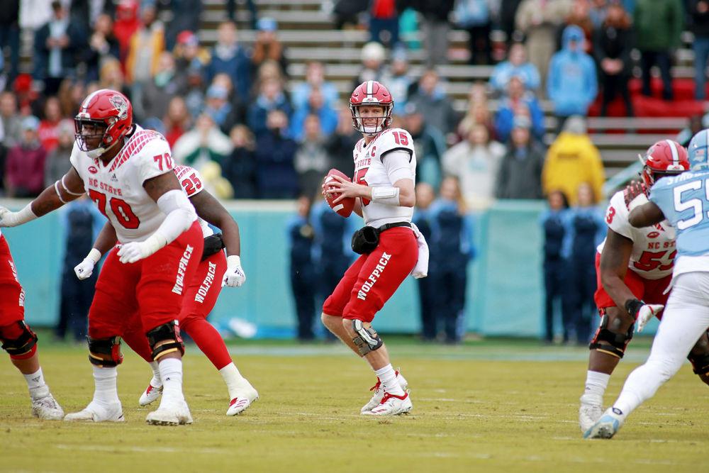Graduate quarterback Ryan Finley looks to pass on Saturday, Nov. 24 in Kenan Memorial Stadium. Finley passed for 200 yards and one interception. The Wolfpack struggled but was able to put away UNC-Chapel Hill in overtime for a 34-28 win.