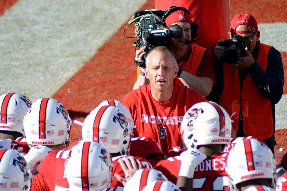 Head Coach Dave Doeren leads his team onto the field on Saturday, Nov. 3 at Carter-Finley Stadium. The Wolfpack won 47-28.