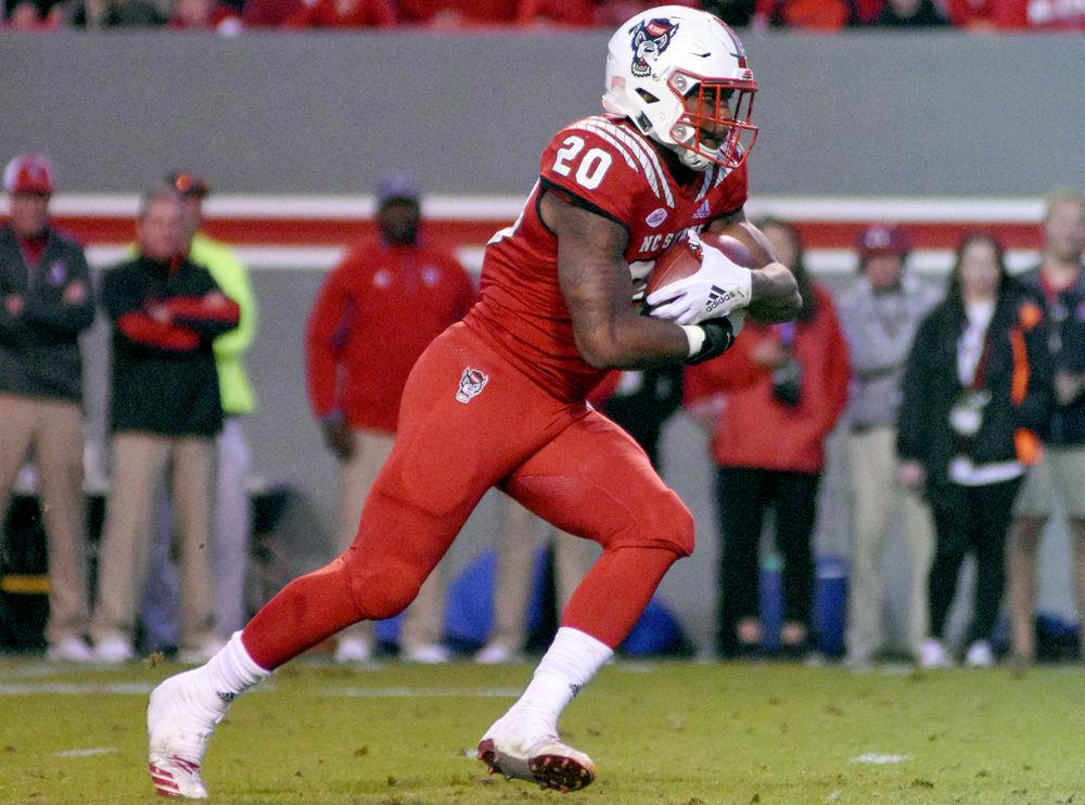 Freshman running back Ricky Person, Jr. carries the ball against Florida State on Saturday, Nov. 3 at Carter-Finley Stadium. Person had 50 rushing yards and two touchdowns on 17 carries in the Wolfpack's 47-28 win.