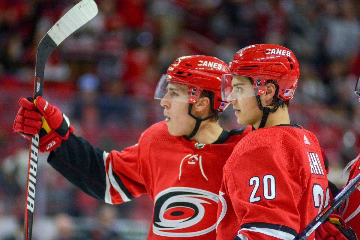Carolina Hurricanes forwards Sebastian Aho and Teuvo Teravainen celebrate after Teravainen's goal against the Chicago Blackhawks on Monday, Nov. 12 in PNC Arena. Aho scored in overtime for the Hurricane's 3-2 win over the Blackhawks.