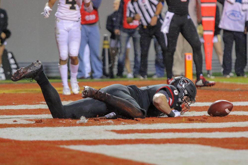 Redshirt sophomore tight end Cary Angeline lays on the ground after dropping a potential touchdown pass on Thursday, Nov. 8 in Carter-Finley Stadium. This was one of many mixed red zone opportunities that ended in a field goal leading the Wolfpack to a 27-23 loss to Wake Forest.