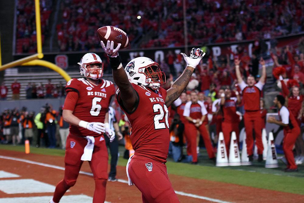 *Editor's note: the main photo has been updated.
Freshman running back Ricky Person Jr. celebrates after his rushing touchdown against Florida State in Carter-Finley Stadium on Saturday, Nov. 3. Person rushed for 2 touchdowns as the Wolfpack won 47-28.