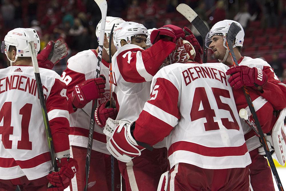 The Detroit Red Wings rush the ice to celebrate with goalie Jonathan Bernier after winning 4-3 in a shootout on Saturday, Nov. 10 in PNC Arena.&#160;