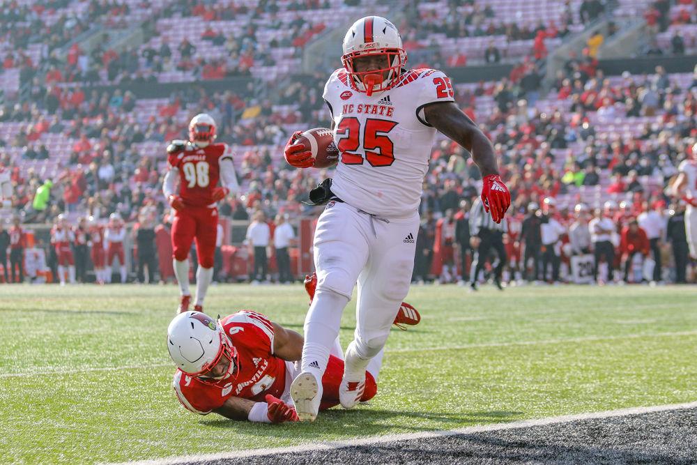 Senior running back Reggie Gallaspy Jr. slips through the Louisville defense and into the end zone for a touchdown on Saturday, Nov. 17 in Cardinal Stadium. Gallaspy totaled 75 yards on 6.6 yards per carry for two touchdowns as the Wolfpack dominated Louisville 52-10&#160;