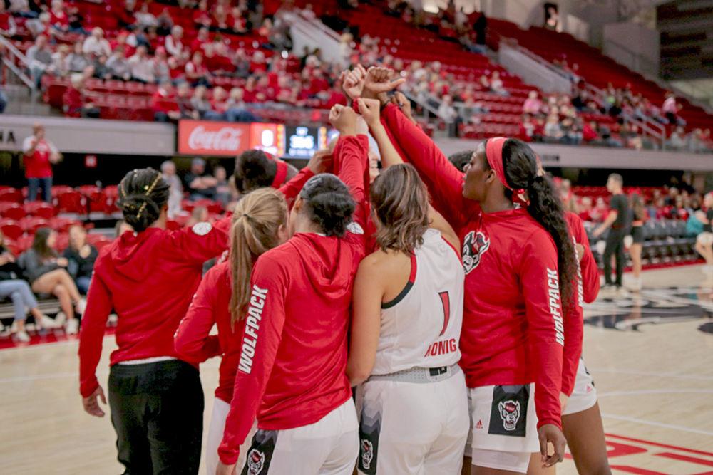 NC State's Women's Basketball huddles before their 75-45 win over Davidson on Sunday, Dec. 30 at Reynolds Coliseum.