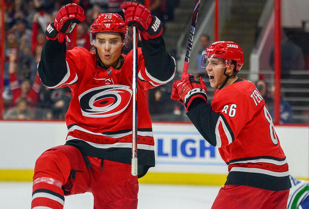 Carolina Hurricanes center Sebastian Aho and left wing Teuvo Teravainen celebrate after Aho scored against the Vancouver Canucks on Tuesday, Oct. 9, 2018 in PNC Arena. The Hurricanes had their third straight win in the regular season against the Canucks 5-3.
