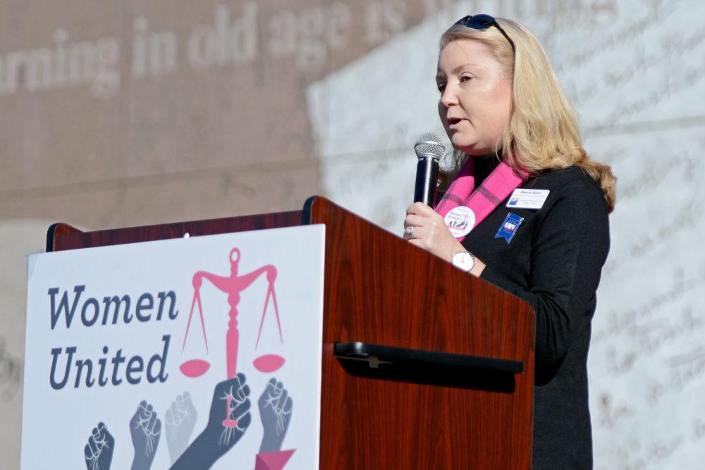 Dianna Wynn, communications coordinator &amp; president elect of&#160;League of Women Voters of Wake County, gives a speech on justice for women during the Women's March in downtown Raleigh on Saturday, Jan. 26.
