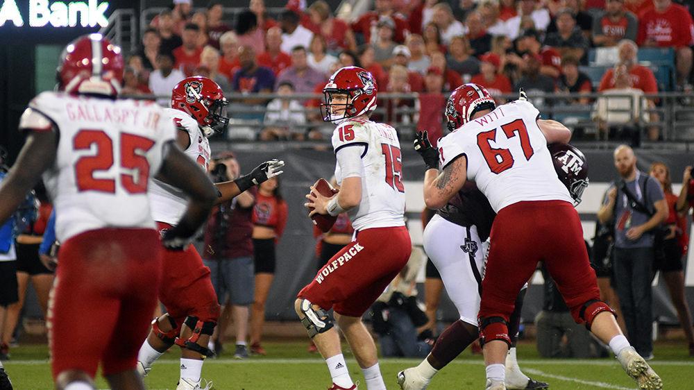Graduate quarterback Ryan Finley winds up to throw the ball at the Gator Bowl at TIAA Bank Field in Jacksonville, Florida on Monday, Dec. 31. NC State lost to Texas A&amp;M 52-13.