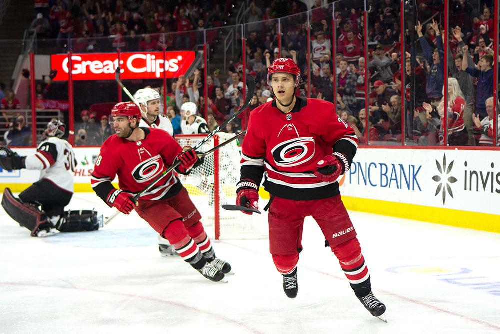 Center Sebastian Aho bails to celebrate after scoring the third goal of the game against the Arizona Coyotes, Sunday, Dec. 16. The Canes won at home, 3-0, after a shot-for-shot loss to the Capitals on Friday.&#160;