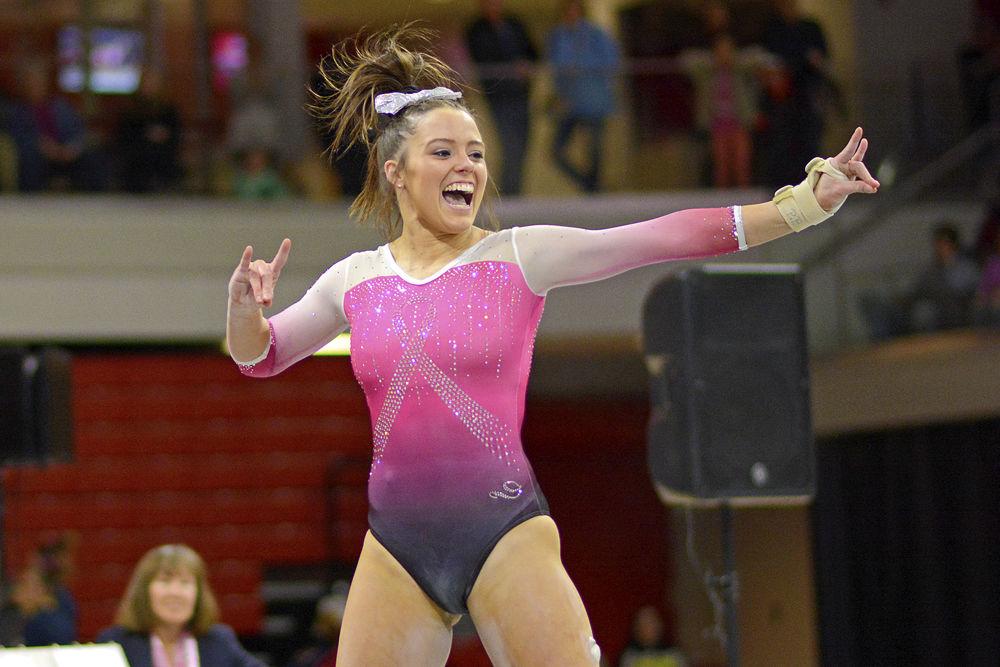 *Editor's note: the original photo has been replaced.
Senior Paris Phillips shoots wolfies during her floor routine at the meet against Pitt on Saturday, Feb. 9 at Reynolds Coliseum. Phillips tied for second in the floor exercise. The Wolfpack defeated the Panthers 196.400 to 194.825.