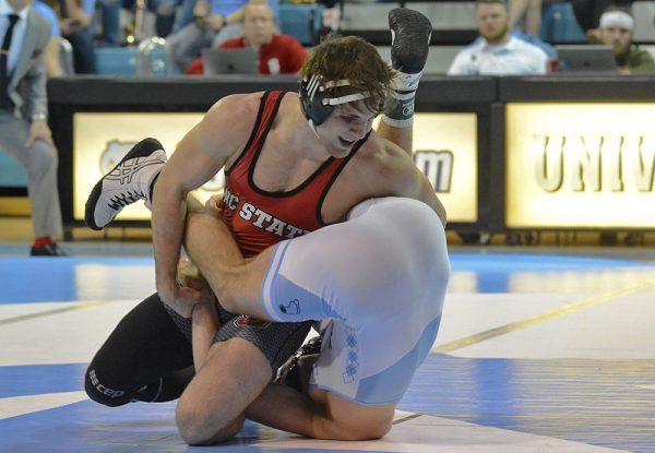 Nick Reenan, a redshirt sophomore in the 184-pound weight class, wrestles UNC-Chapel Hill redshirt senior Chip Ness on Friday, Feb. 15, 2019 in Carmichael Arena. The Wolfpack beat the Tar Heels 20-14.