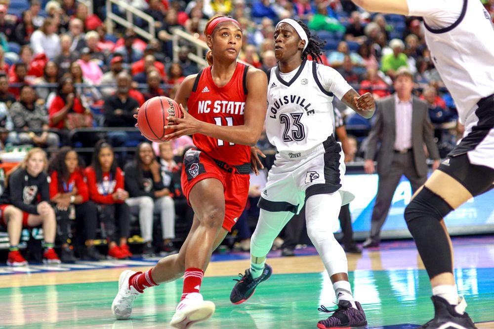 Graduate guard Kiara Leslie makes a move around Louisville guard Jazmine Jones during the ACC Tournament. Leslie had 10 points during the 78-68 loss to Louisville on Saturday, March 9 in Greensboro Coliseum.