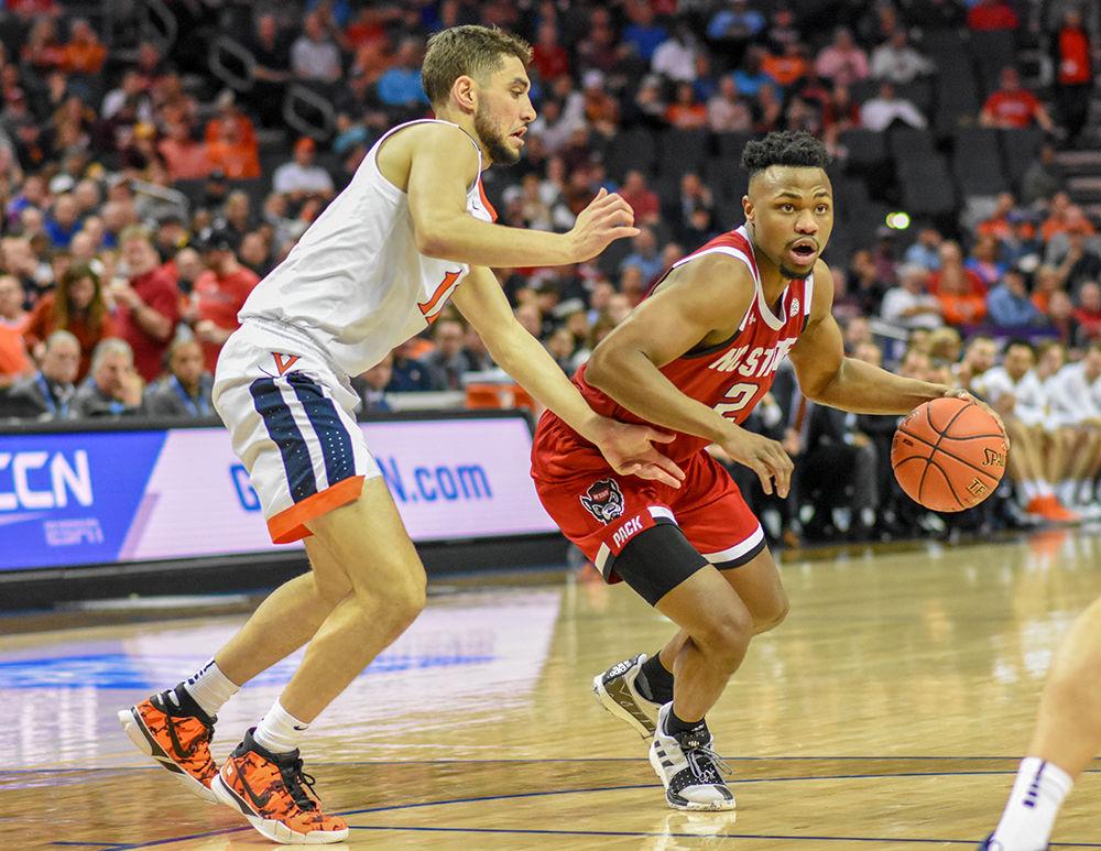 Redshirt senior Torin Dorn looks to make a play during the ACC Tournament game versus Virginia on Thursday, March 14, 2019 in the Spectrum Center. Dorn scored 7 points and had 7 rebounds against the Cavaliers. The Wolfpack lost to Virginia 76-56.