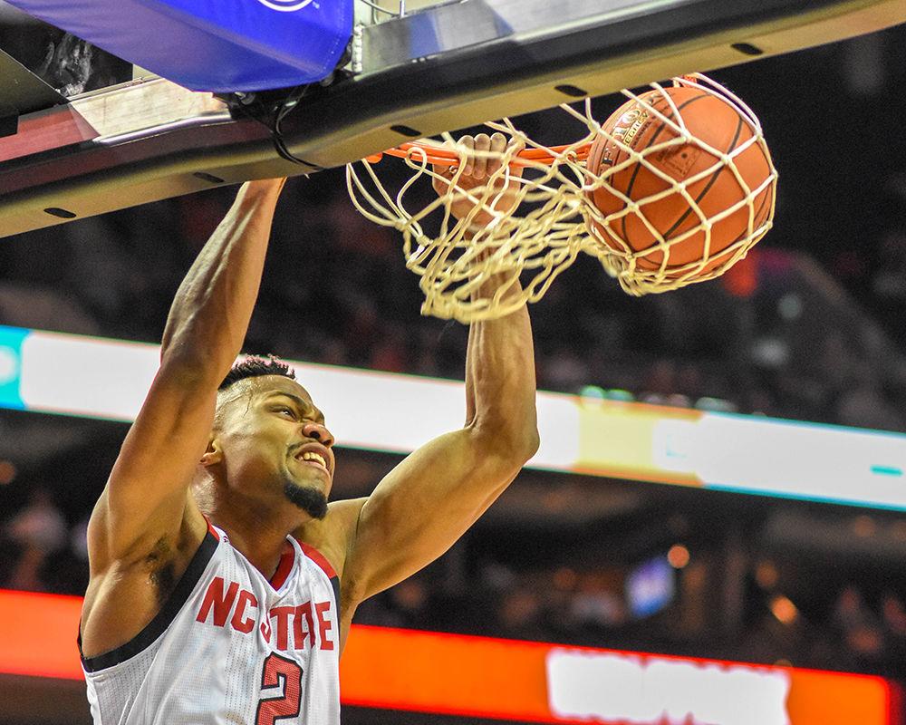 Redshirt senior guard Torin Dorn dunks the ball during the game versus the Clemson Tigers on Wednesday, March 13, 2019 in the Spectrum Center during the ACC Tournament. Dorn scored 8 points and had 12 rebounds against the Tigers. The Wolfpack beat the Tigers 59-58.