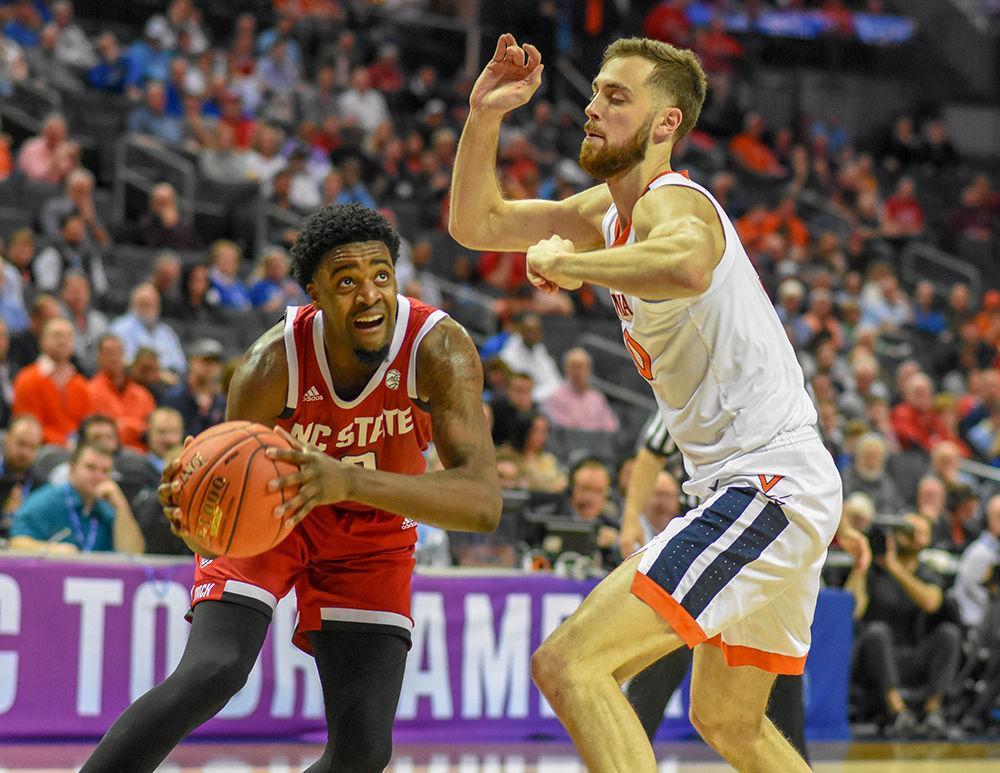 Redshirt sophomore forward DJ Funderburk makes an attempt to get to the basket during the ACC Tournament game versus Virginia on Thursday, March 14, 2019 in the Spectrum Center. Funderburk scored 12 points and shot 4-6 against the Cavaliers. The Wolfpack lost to Virginia 76-56.