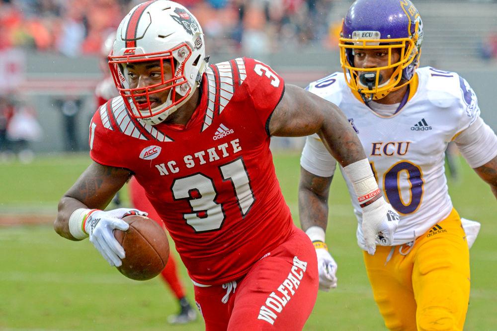 Redshirt junior safety Jarius Morehead carries the ball in the last home football game versus ECU on Saturday, Dec. 1, 2018 in Carter-Finley Stadium. The Wolfpack beat the Pirates 58-3.