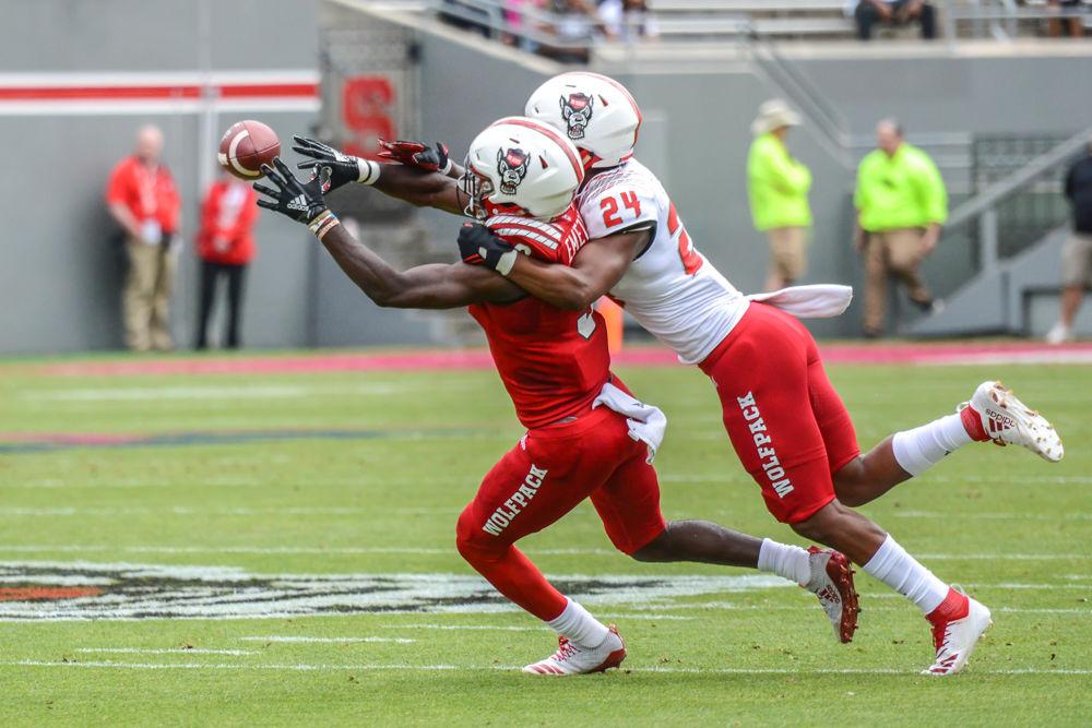 Junior wide receiver Emeka Emezie hauls in a catch despite coverage by redshirt freshman cornerback Malik Dunlap during the Kay Yow Spring Game on Saturday, April 6, 2019 at Carter-Finley Stadium. Emezie will be a key player in the Wolfpack passing game this fall.
