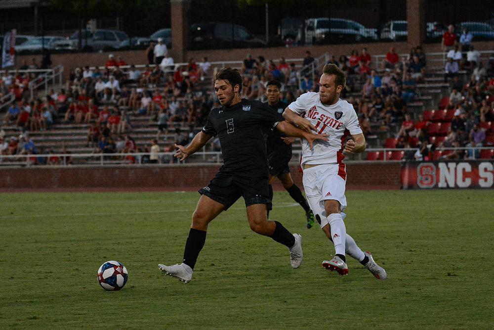 Senior forward Tyler Gabarra attempts to take back control of the ball during the game versus Loyola on Friday, August 30, 2019 in Dail Soccer Park. Gabarra had one assist against the Greyhounds. NC State beat Loyola 2-1.