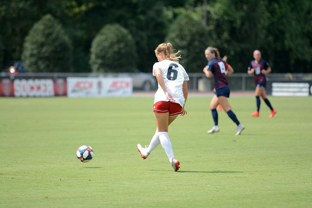 Redshirt sophomore defender Lulu Guttenberger passes the ball to a teammate on Sunday, Sep. 8, 2019. The NC State women's soccer team defeated Duquense, 3-0, at Dail Soccer Stadium.