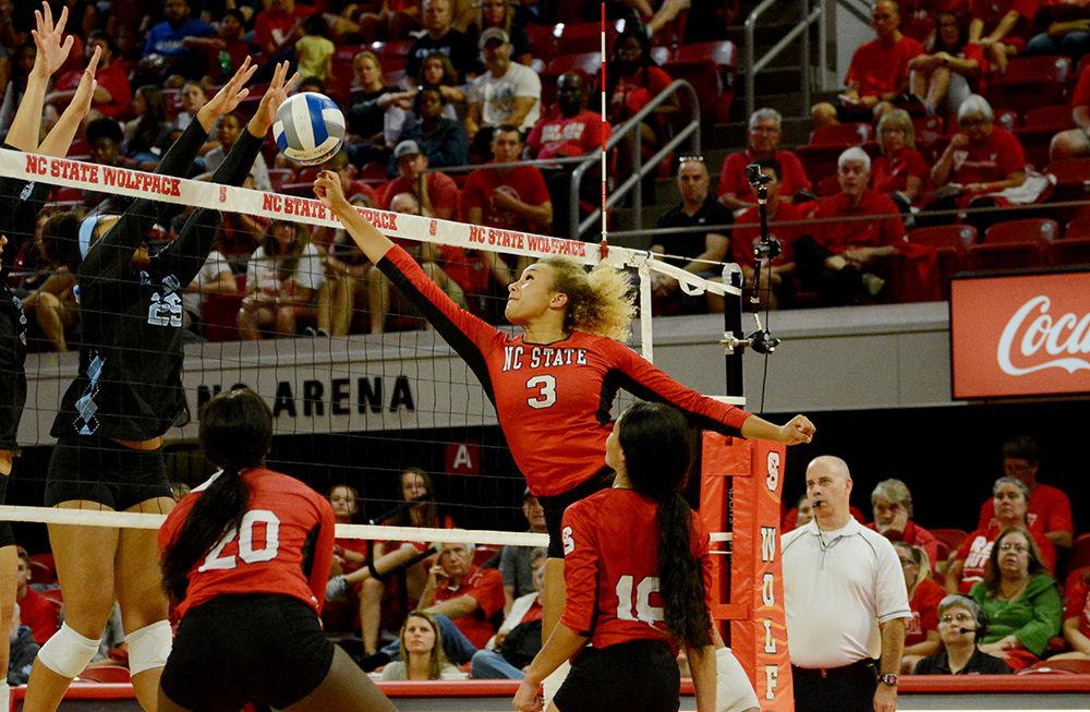 Junior Melissa Evans leaps to tip the ball over the net against UNC on Wednesday, Oct. 2, 2019 in Reynolds Coliseum. Evans played in 5 sets, had 15 kills, and 5 digs with a total 16.5 points in the 2-3 loss against UNC.